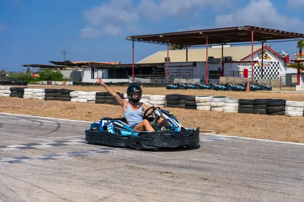 Waving at the finish at Bushiri Karting