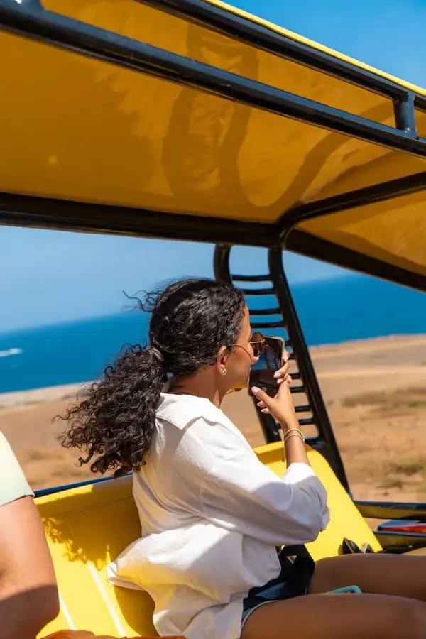Talitha taking photos from the ABC Tours jeep